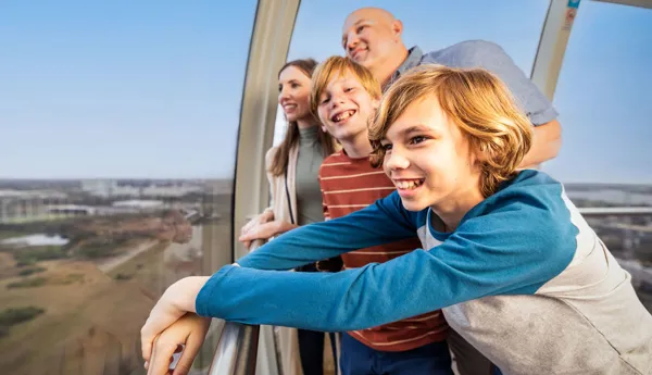 Family looking at a blue sky from The Orlando Eye